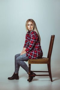beautiful young woman sitting on chair
